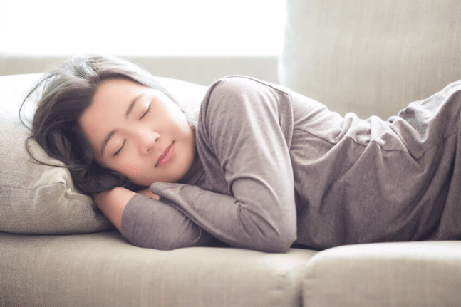 Woman sleeping on lounge